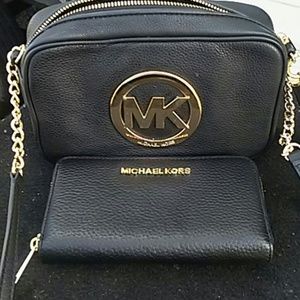 Micheal Kors small purse and matching wait